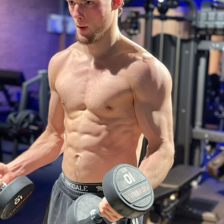 Charlie Lynch-Spence strength training with dumbbells