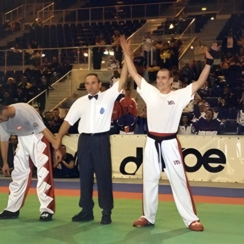 Sensei Paul Lynch celebrating after a championship fight