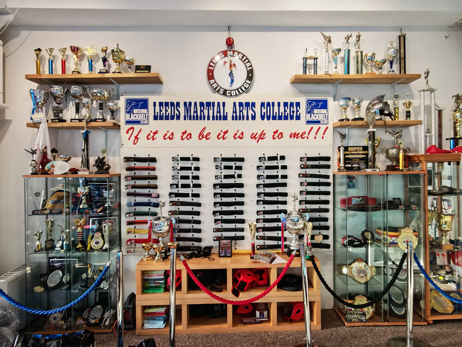 Trophy cabinets, championship awards and martial arts belts displayed at Leeds Martial Arts College